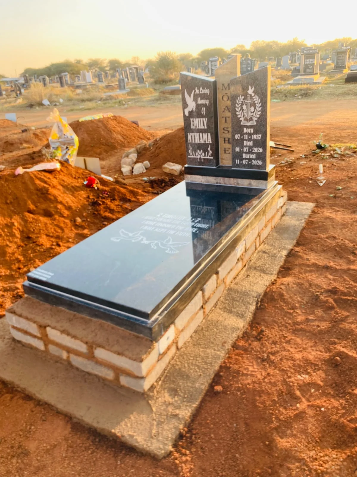 Upright granite tombstone with a refined polished finish